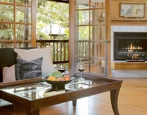 lotus garden cottage room with fireplace and french doors open